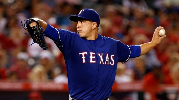 MLB Notes: Rangers put Derek Holland on DL, and Colby Lewis won't