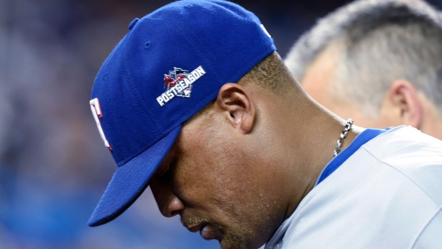 Retired Texas Rangers player Adrian Beltre, left, is presented