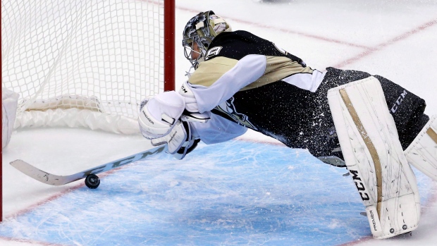 Pittsburgh Penguins goalie Marc-Andre Fleury (29) makes a save off the end  of his pad during the first period against the New York Rangers during the  Eastern Conference Quarterfinals of the 2015