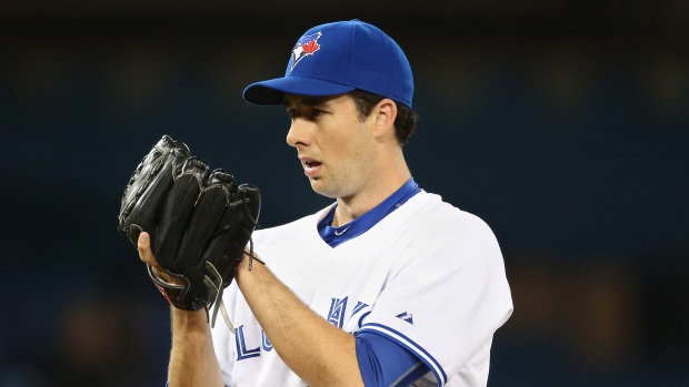 Colorado Rockies starting pitcher Jeff Francis walks away from a