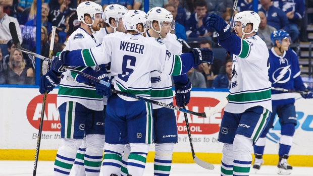 Canucks players celebrate