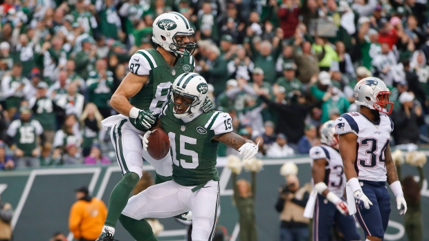 Jets move into playoff position, 26-20 in OT over Patriots