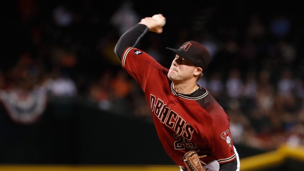 Andrew Chafin of the Arizona Diamondbacks delivers a pitch against News  Photo - Getty Images