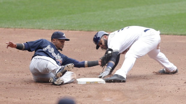 Brewers score in every inning to beat Braves