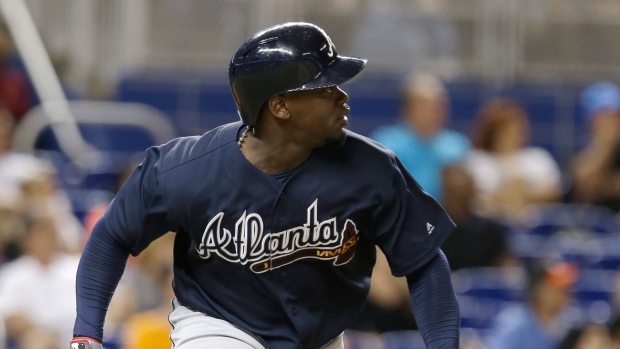 Phillips wins it again as Braves top Marlins 5-4