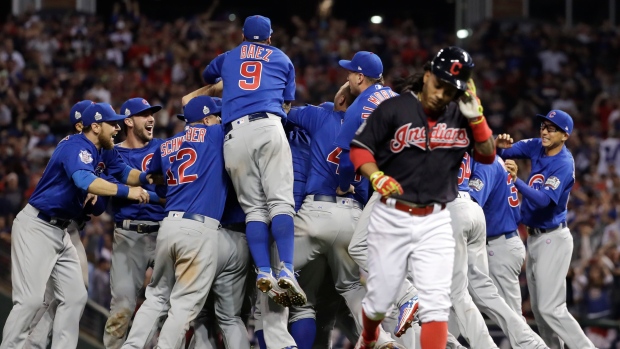 President Barack Obama smiles as Chicago Cubs first baseman