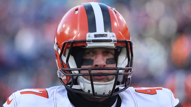 Browns sign long snapper Hughlett for six years 