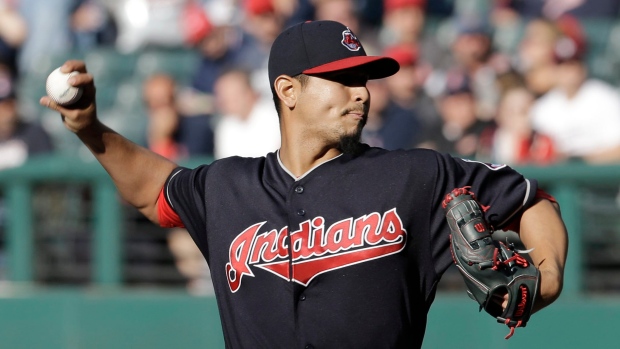 Cleveland Indians pitcher Carlos Carrasco throws live batting