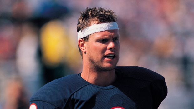 Quarterback Jim McMahon of the San Diego Chargers looks on during a