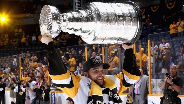 Phil Kessel signs Penguins fan's baby at Stanley Cup parade 