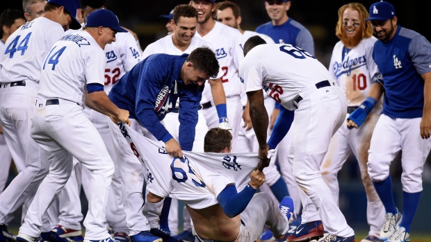 Dodgers celebrate Farmer's walk-off in first Major League at-bat