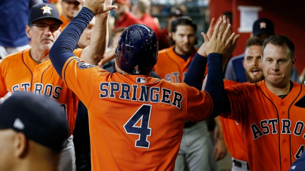 Determined to be the first to get a high-five, David Peralta tried to hold  Taijuan Walker back