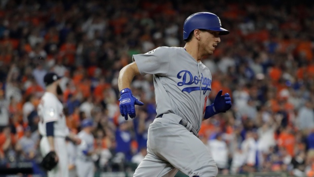 Los Angeles Dodgers catcher Austin Barnes, left, and relief