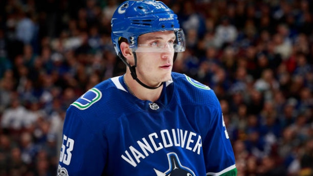 The Vancouver Canucks Flying Skate jersey of Bo Horvat hangs in